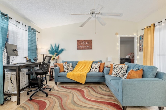 office with a textured ceiling, ceiling fan, and lofted ceiling