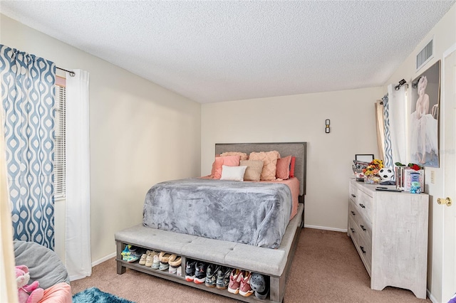 carpeted bedroom with a textured ceiling