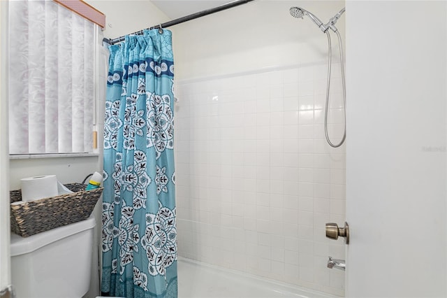 bathroom with toilet and shower / bathtub combination with curtain