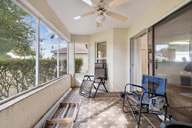 sunroom / solarium with ceiling fan