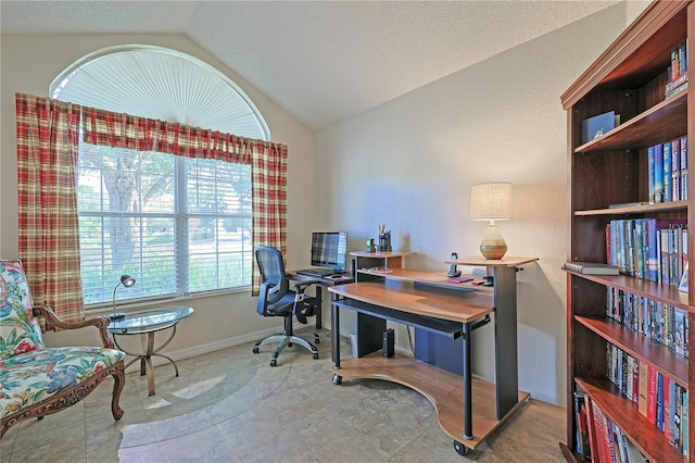 home office featuring a textured ceiling and vaulted ceiling