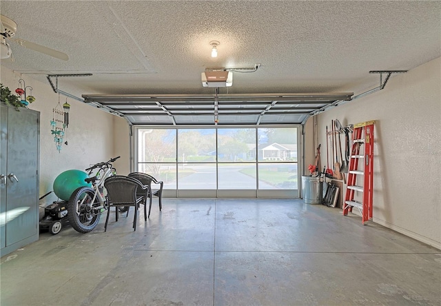 garage with ceiling fan and a garage door opener