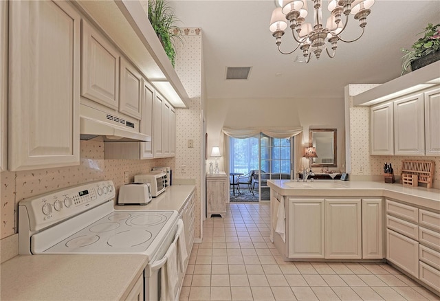 kitchen featuring electric range, sink, an inviting chandelier, ventilation hood, and light tile patterned floors