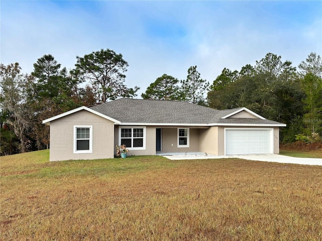 ranch-style home featuring a garage and a front yard