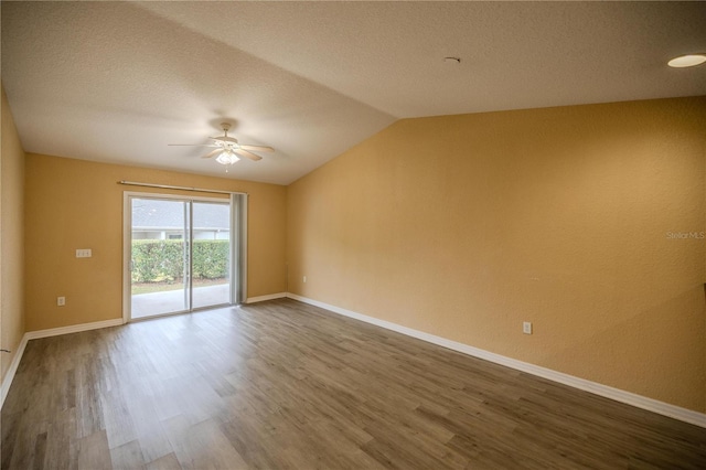 unfurnished room featuring a textured ceiling, ceiling fan, hardwood / wood-style floors, and lofted ceiling