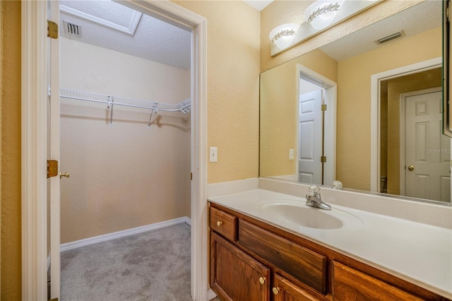 bathroom featuring vanity and a textured ceiling