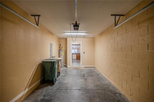 garage with electric water heater and a garage door opener