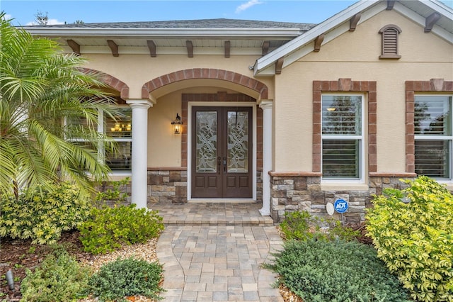 entrance to property featuring french doors