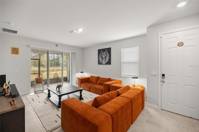 living room featuring light tile patterned floors