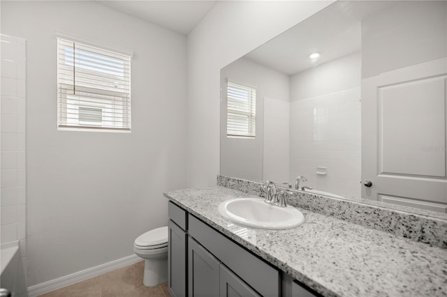 bathroom featuring tile patterned flooring, vanity, and toilet