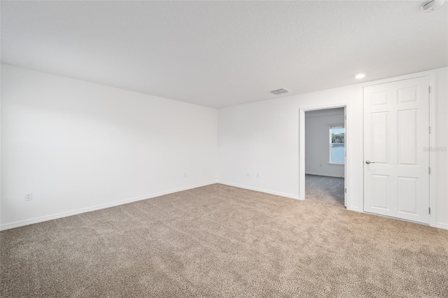 spare room featuring carpet flooring