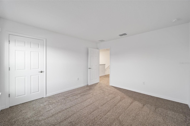 view of carpeted spare room