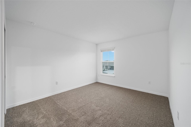 unfurnished room with carpet floors