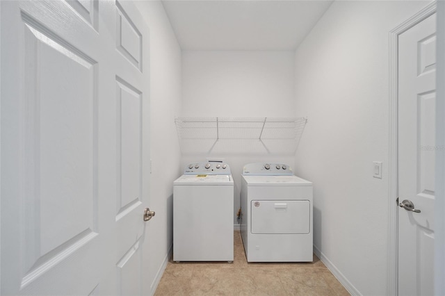 laundry room featuring washer and clothes dryer