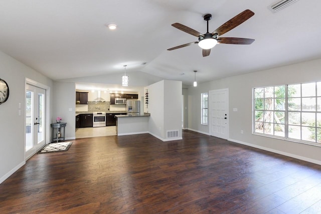 unfurnished living room with french doors, dark hardwood / wood-style flooring, ceiling fan, and lofted ceiling