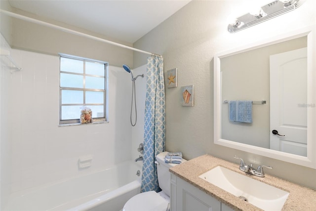 full bathroom with vanity, shower / tub combo, and toilet