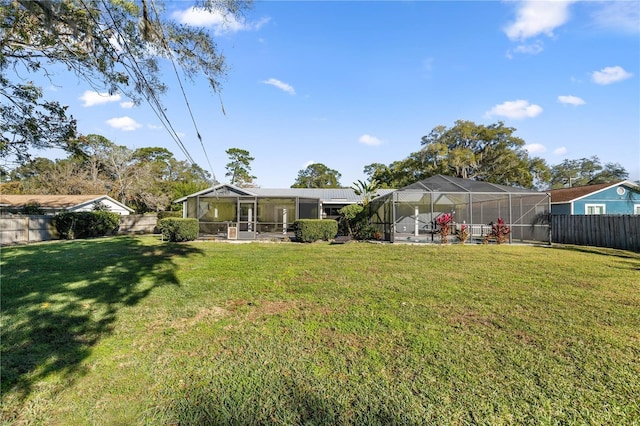 view of yard featuring glass enclosure