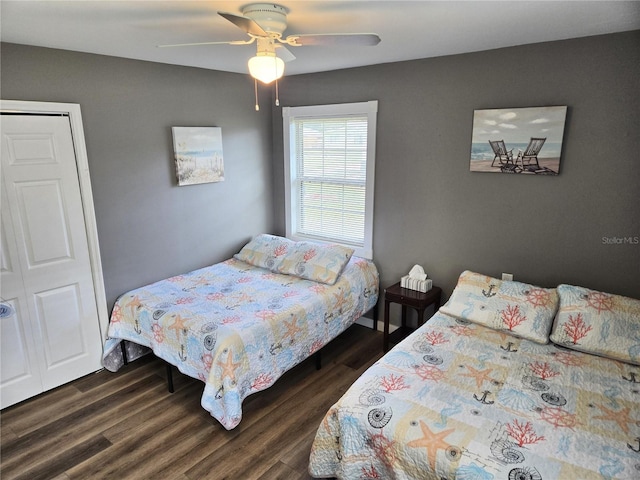 bedroom featuring a closet, ceiling fan, and dark wood-type flooring