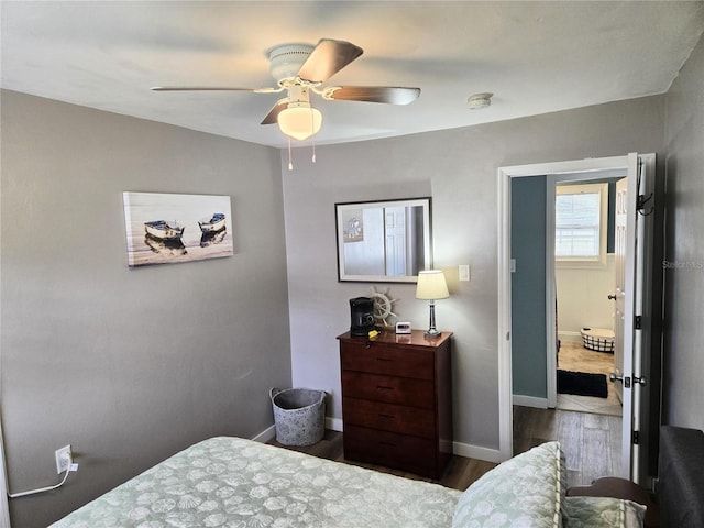 bedroom featuring ceiling fan and dark hardwood / wood-style flooring