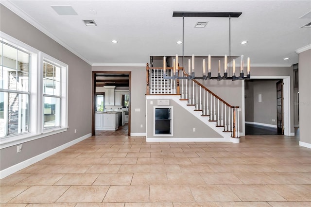 unfurnished living room with light tile patterned flooring, crown molding, and a chandelier