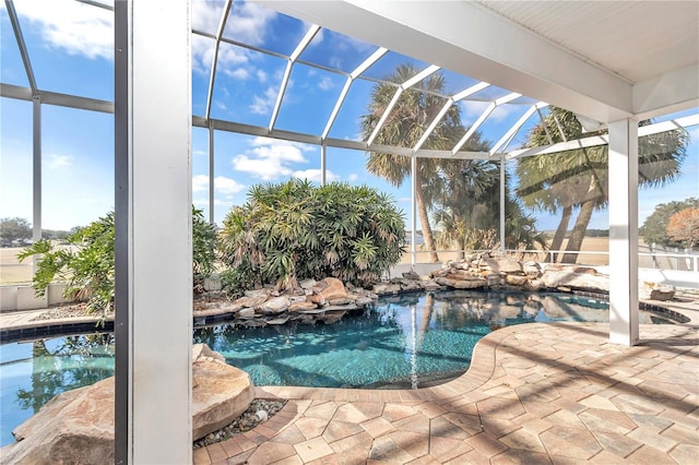 view of pool featuring a patio area and a lanai