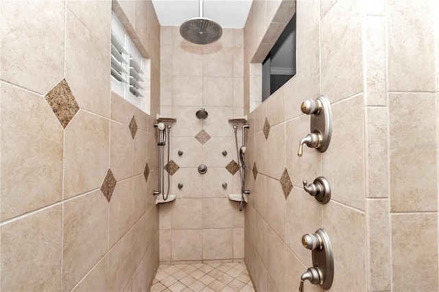 interior details featuring a tile shower