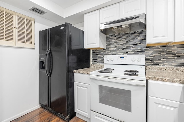 kitchen with white cabinets, black fridge, dark hardwood / wood-style floors, and white range with electric cooktop