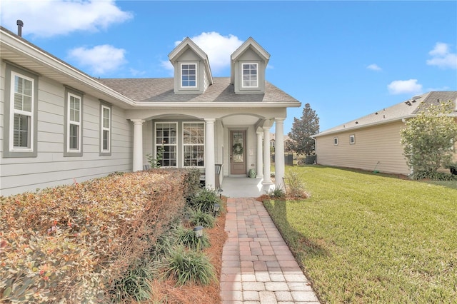 doorway to property with a yard