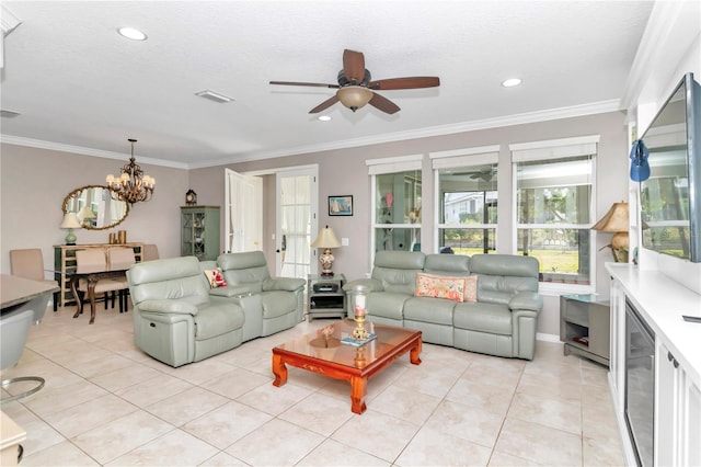 tiled living room featuring crown molding, ceiling fan with notable chandelier, and a textured ceiling