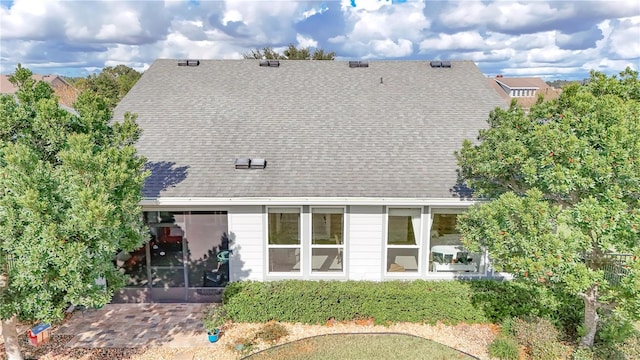 back of house with a sunroom