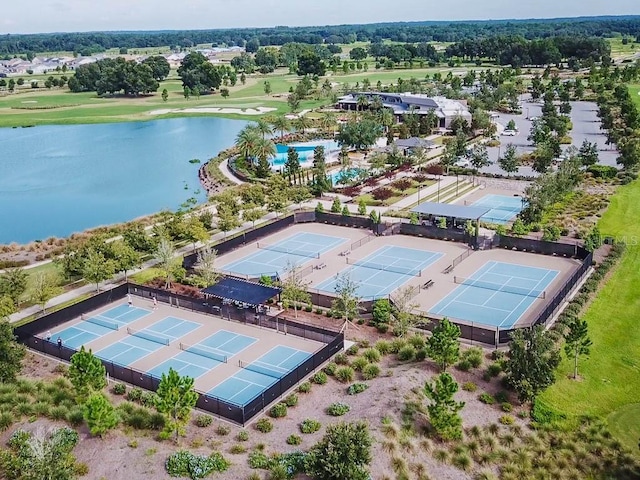 birds eye view of property with a water view