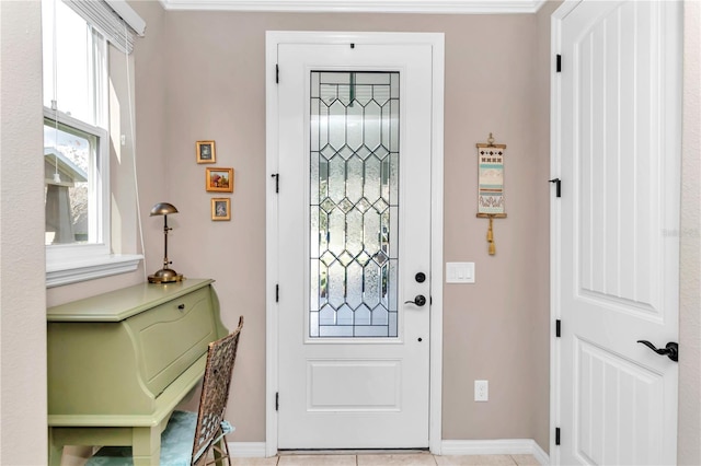 tiled foyer with crown molding