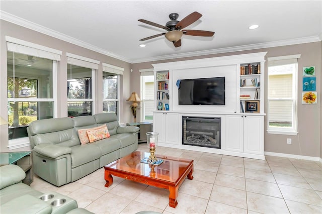 tiled living room with ceiling fan, a healthy amount of sunlight, and ornamental molding