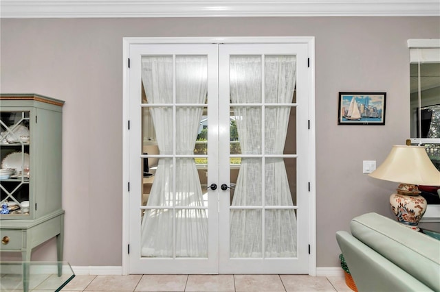 doorway featuring french doors, crown molding, and light tile patterned floors