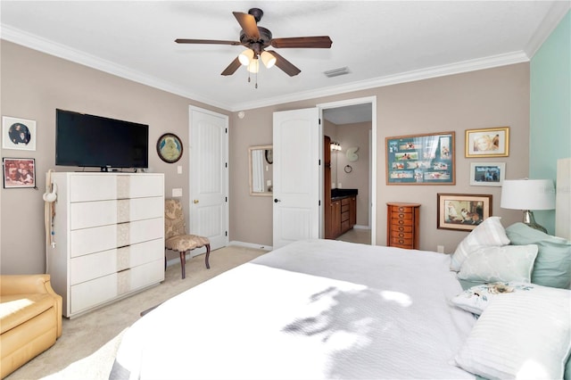 carpeted bedroom with ornamental molding, ceiling fan, and ensuite bathroom