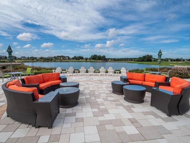 view of patio featuring a water view and an outdoor living space