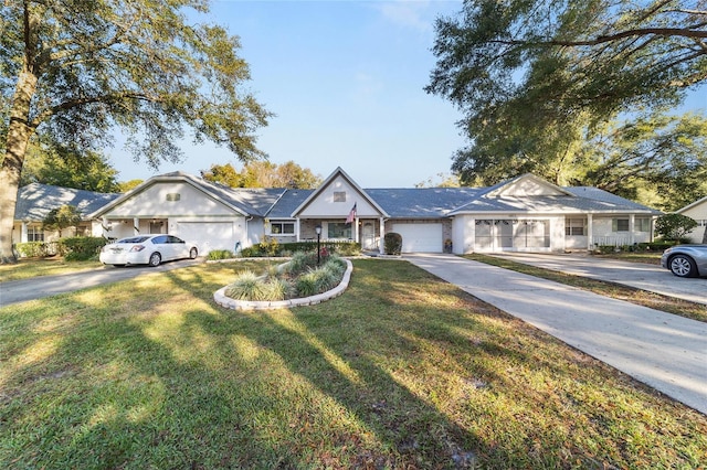 ranch-style home with a garage and a front yard