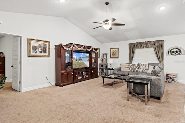 carpeted living room featuring ceiling fan and lofted ceiling