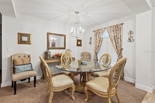 dining area with light wood-type flooring and a chandelier