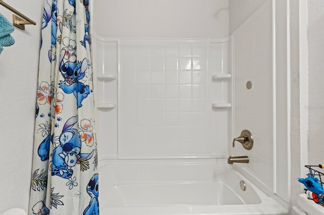 bathroom with shower / tub combo