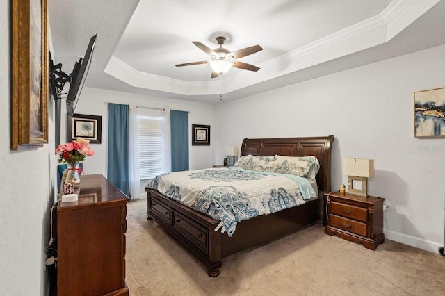 bedroom with light carpet, a raised ceiling, ceiling fan, and ornamental molding