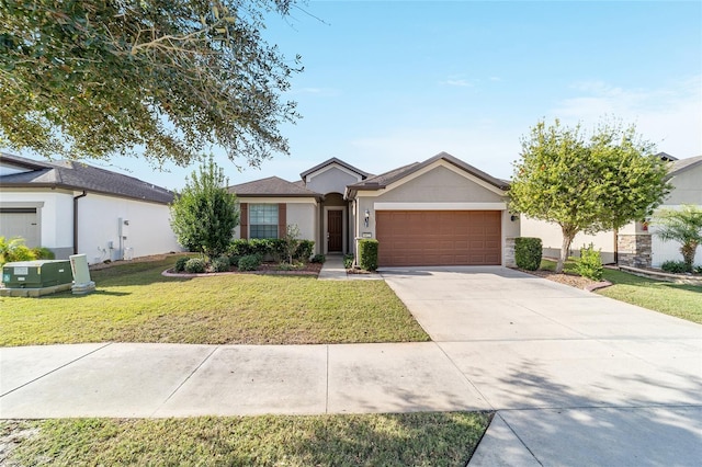 ranch-style home featuring a garage and a front lawn