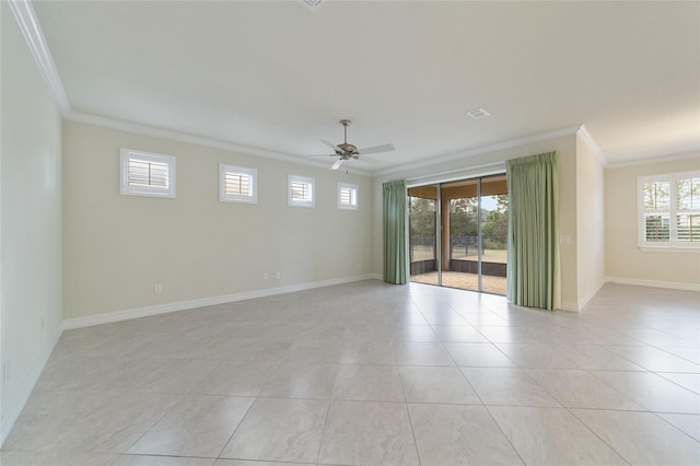 tiled spare room with plenty of natural light, ceiling fan, and ornamental molding