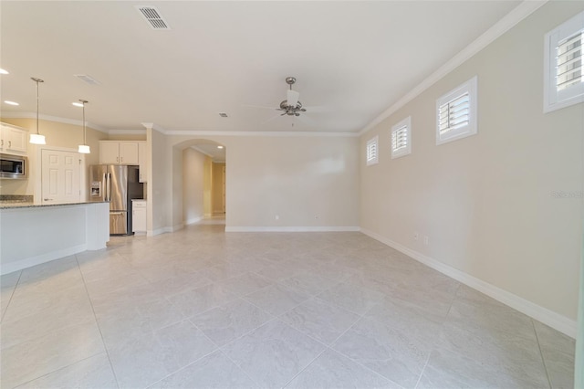 unfurnished living room with ceiling fan, ornamental molding, and light tile patterned floors