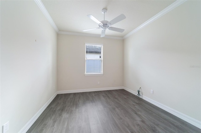 spare room with crown molding, ceiling fan, and dark wood-type flooring