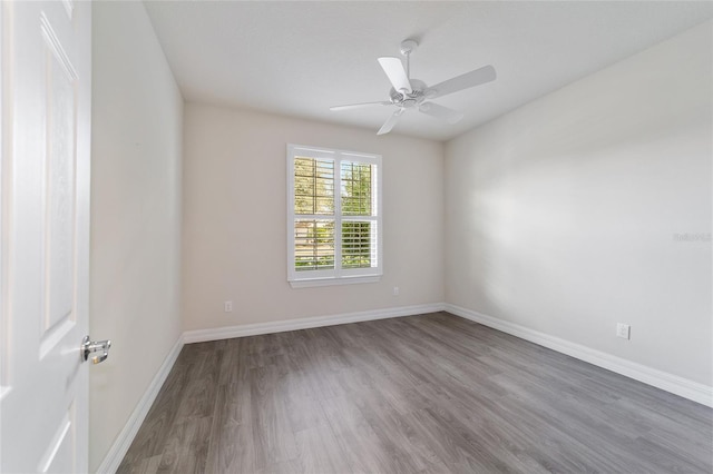 unfurnished room featuring hardwood / wood-style floors and ceiling fan