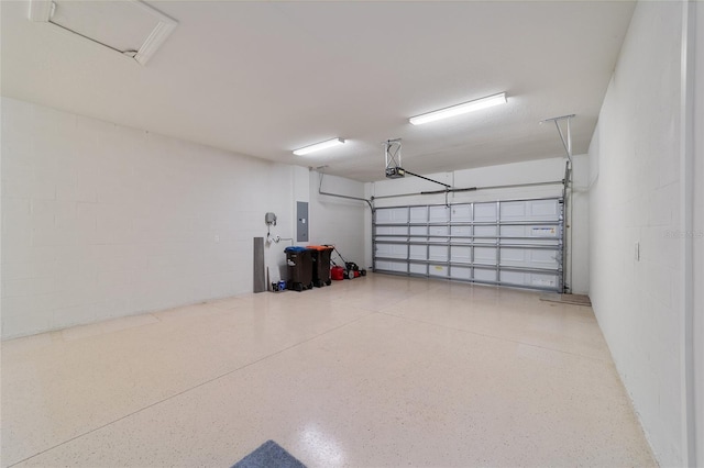 garage with electric panel and a garage door opener