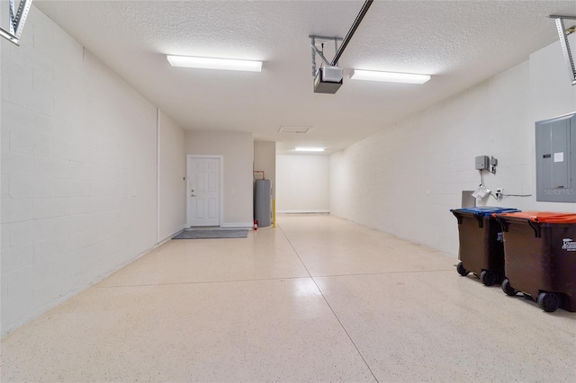 garage with electric water heater, electric panel, and a garage door opener