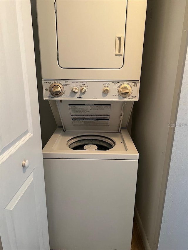 washroom featuring stacked washer and dryer