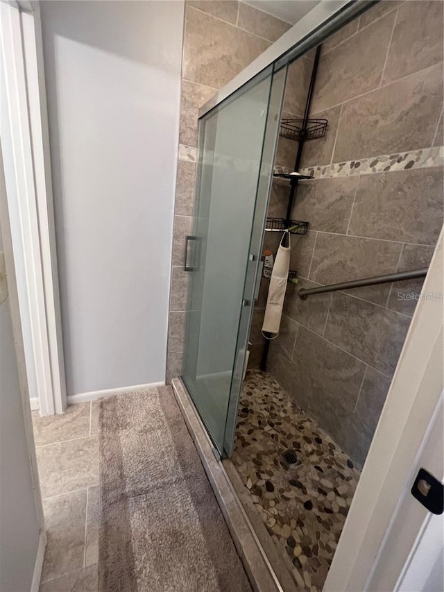 bathroom featuring an enclosed shower